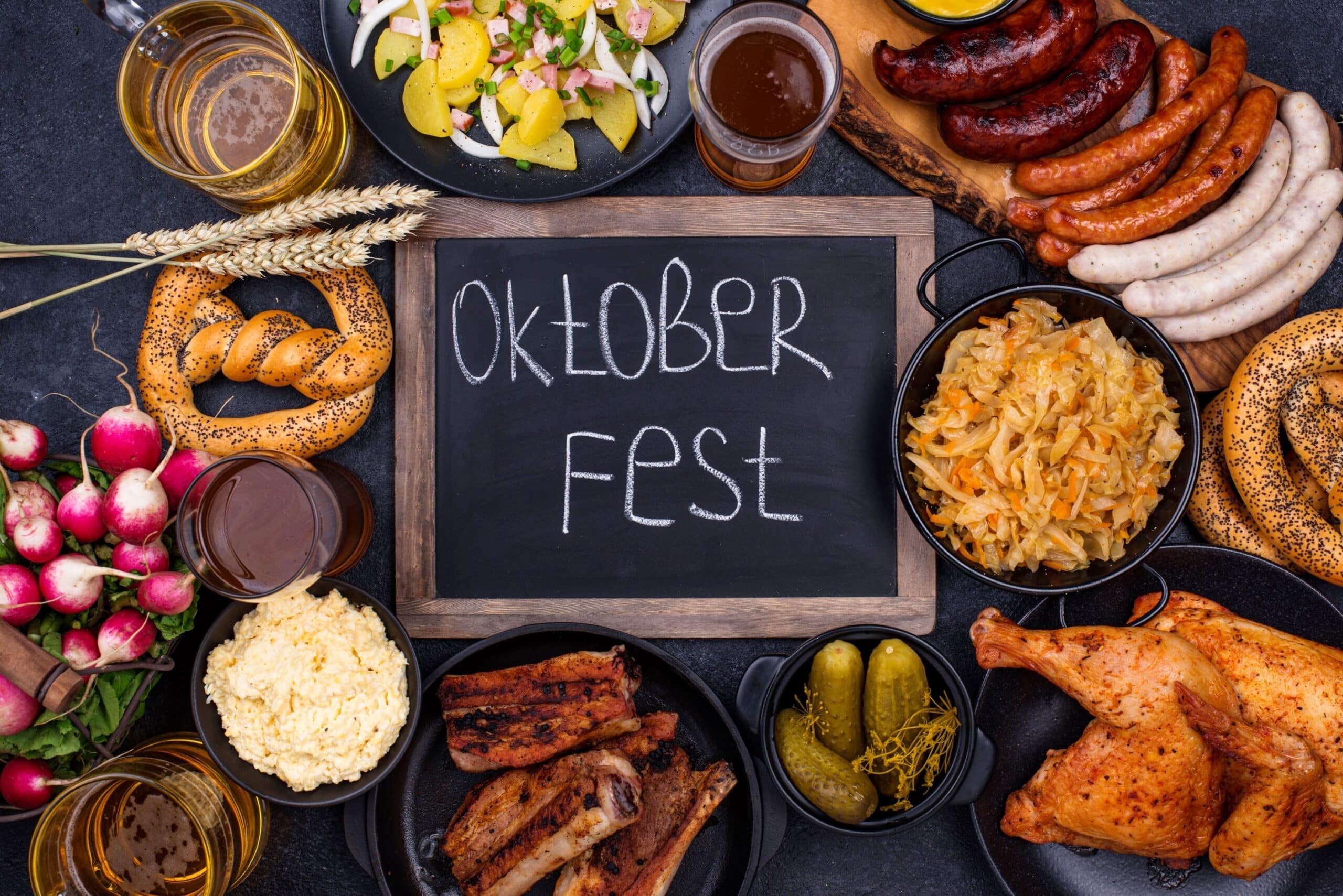 Oktoberfest sign surrounded by traditional German food