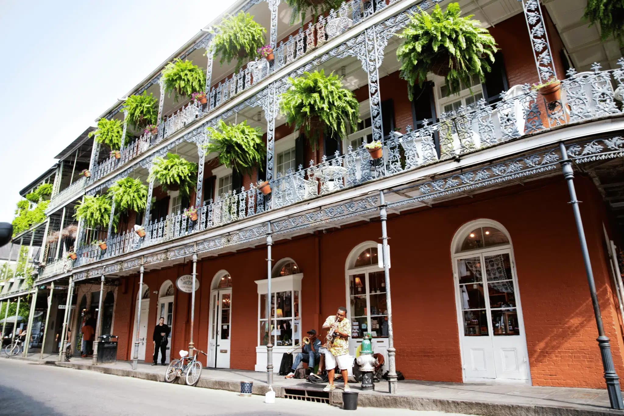 a street musician playing on the side of the road in the french quarter