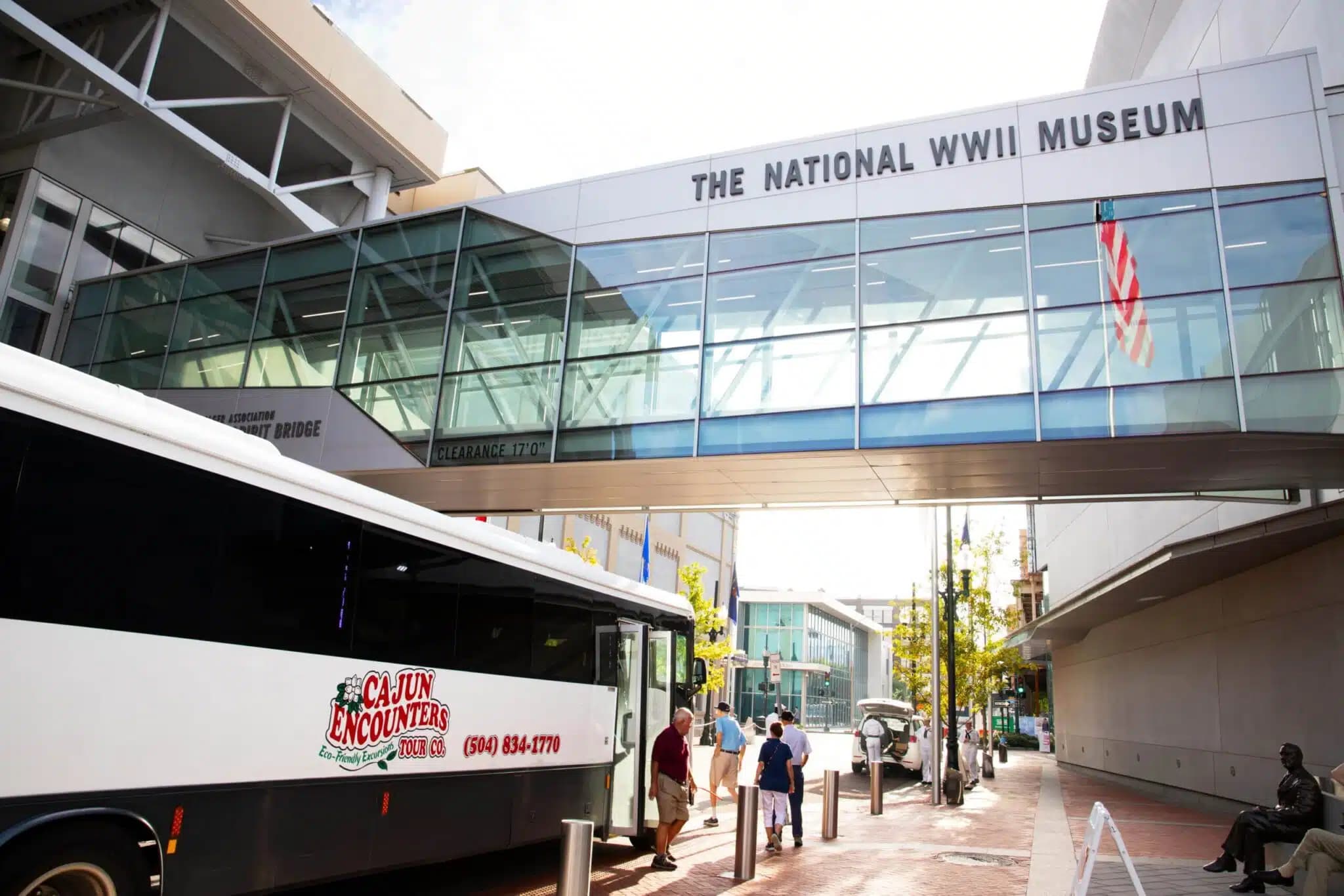 Exterior of New Orleans National WW2 museum with a cajun encounters bus in view