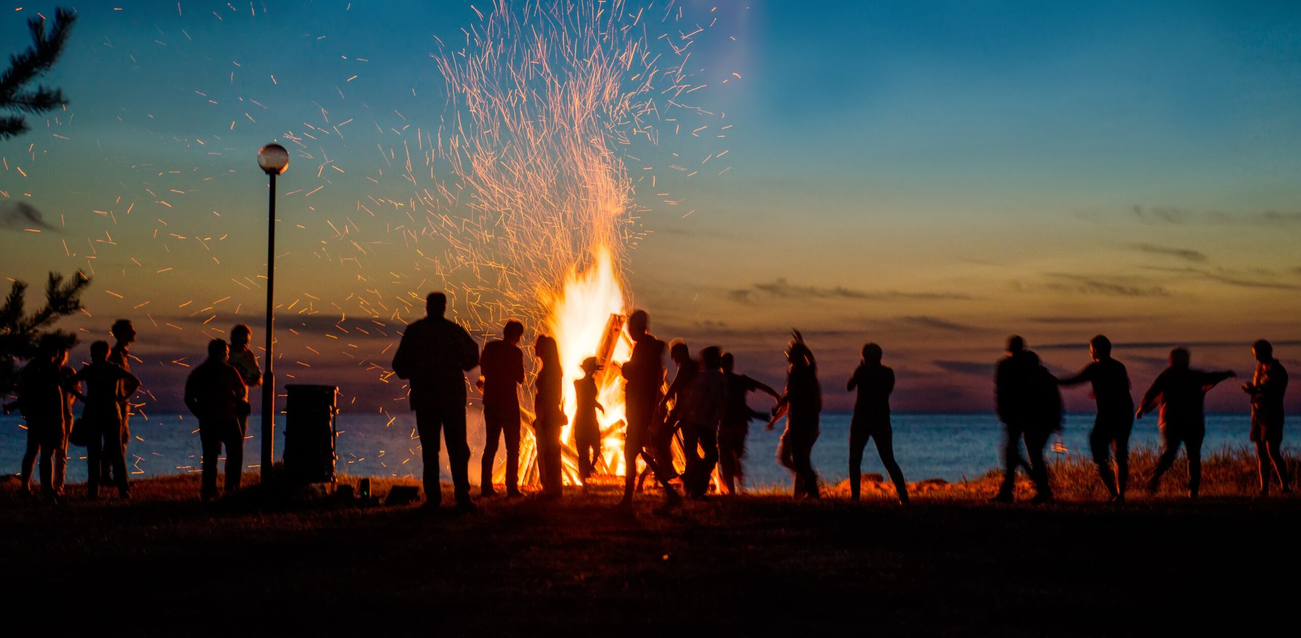 People attend the New Orleans Christmas Eve bonfires on the levee of the Mississippi River